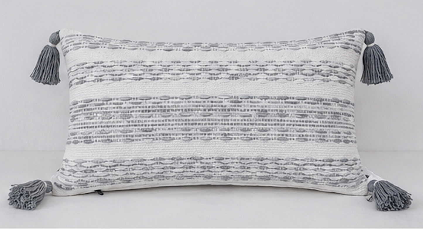 Add a touch of elegance and comfort to your living space with this beautifully handwoven cotton cushion cover. Featuring a sophisticated grey and ivory textured pattern with decorative tassels