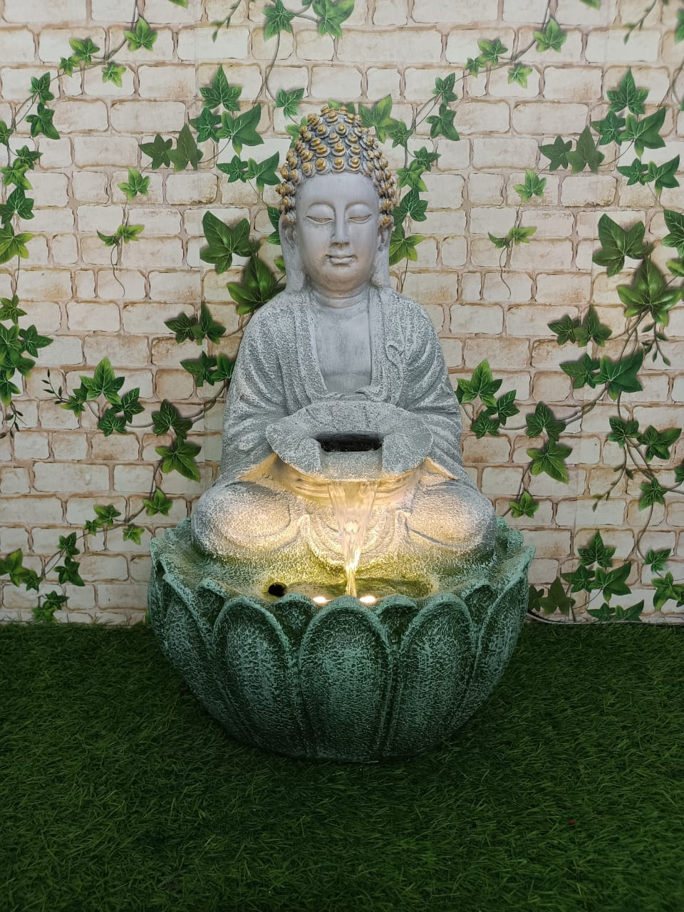 DECORATIVE BUDDHA FOUNTAIN STATUE.